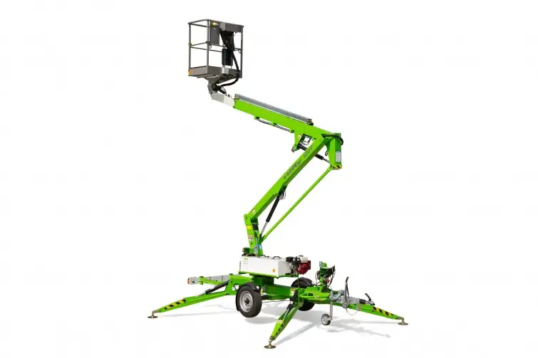 A compact green towable boom lift fully set up with stabilisers and elevated basket, designed for safe and flexible access on tight job sites — perfect for tradies and crews needing reliable gear from All Access Hire.