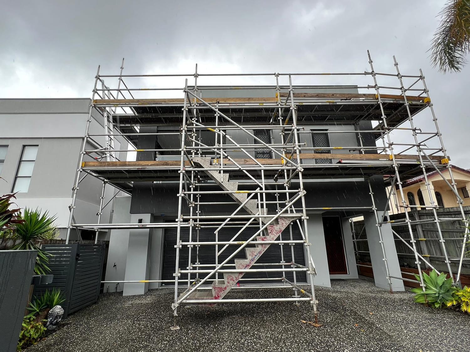 House with scaffolding at the front