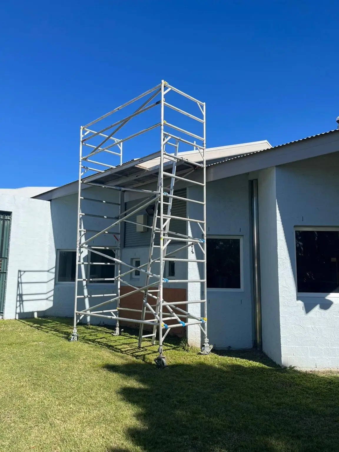 Aluminium scaffolding structure set up on a commercial site for insured event repairs in Brisbane, part of All Access Hire’s scaffold hire services.