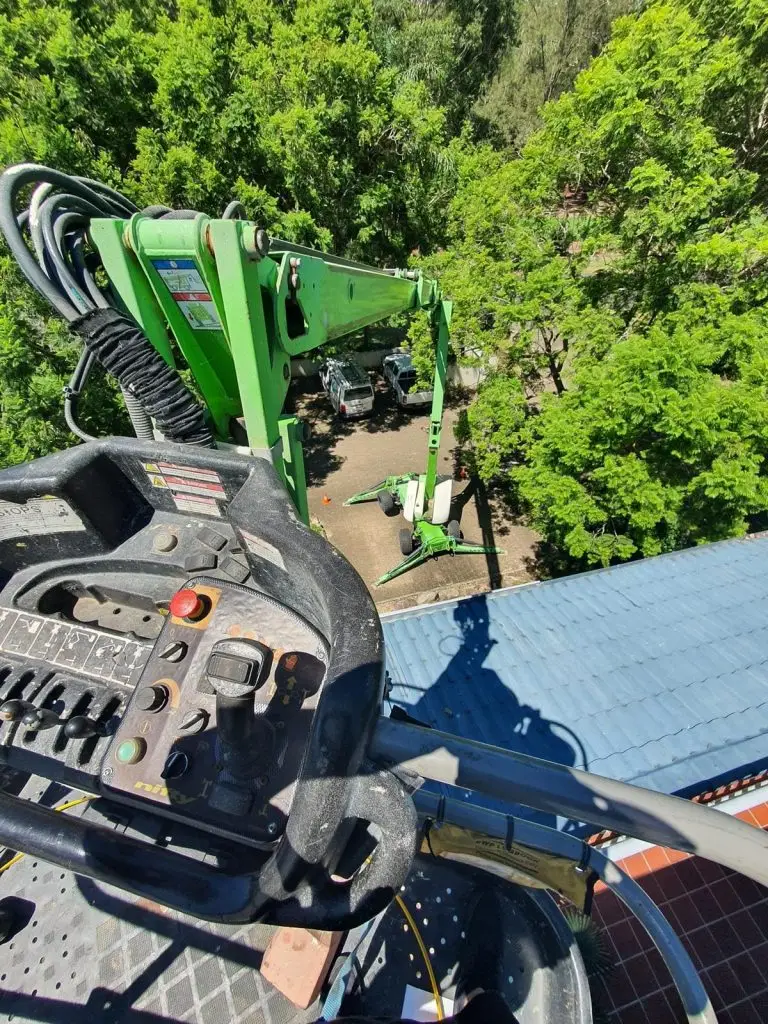 The top of a Green Nifty Boom Lift 4WD in action at a job site in Queensland.